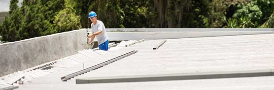 Roofer working on a commercial roof